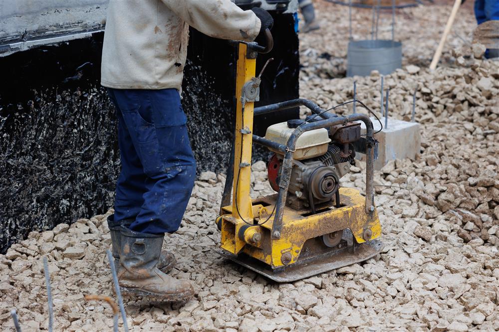  Worker Using Vibratory Plate Heavy Machine Compactor